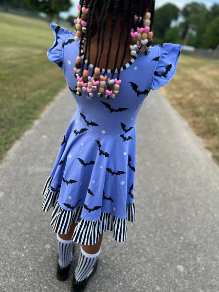 Batty Purple Knit Bat Print Swing Dress with Black and White Stripe Ruffle