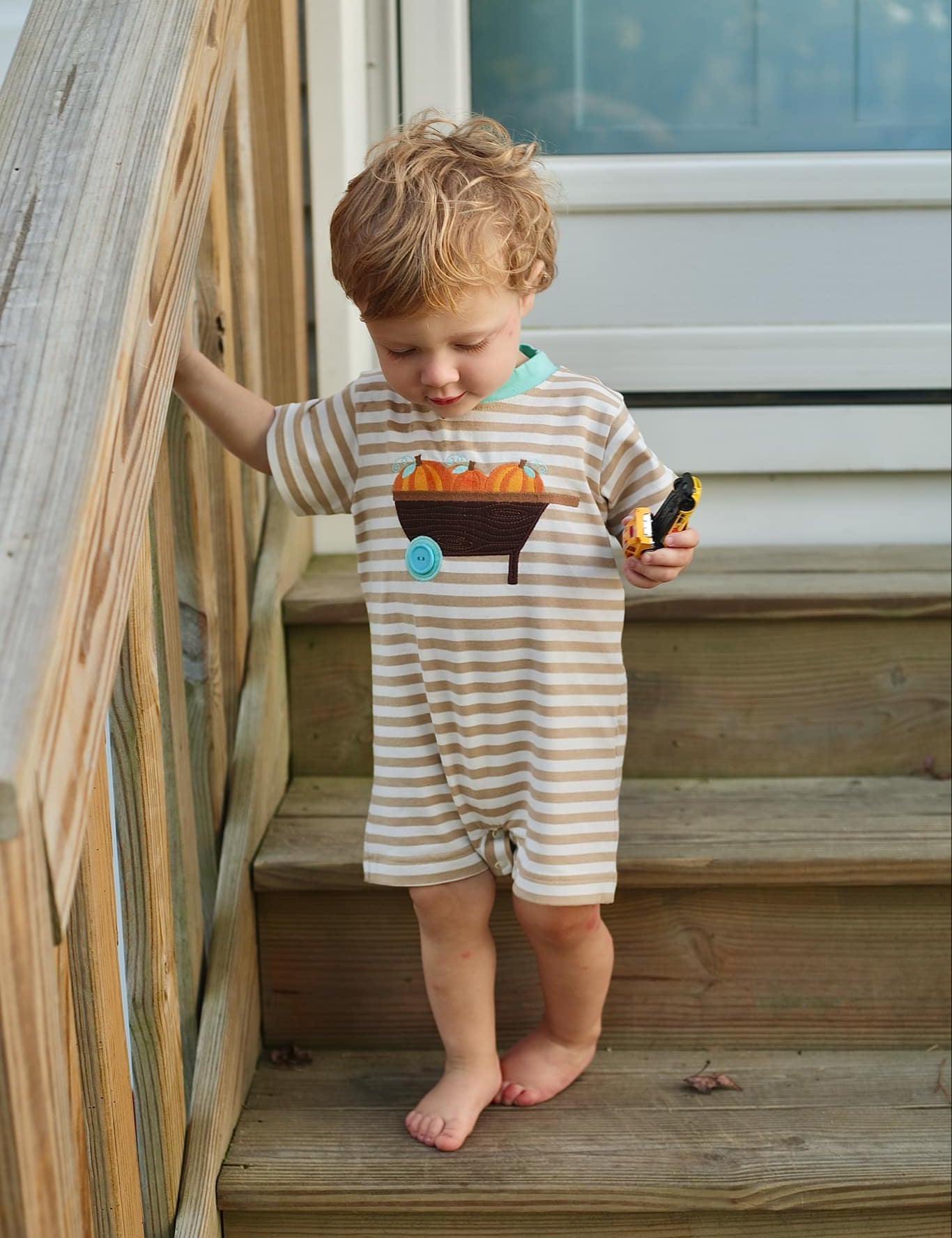 Pumpkin Harvest Boys' Tan Stripe Knit Romper with Pumpkin Wheelbarrow Applique