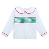 White blouse with red trim and green pattern on a white background