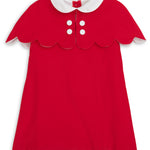 Red dress with white collar and buttons on a white background