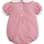 A baby romper in a red and white gingham check pattern, featuring a white collar, short puff sleeves with white cuffs, and three white buttons on the front.