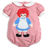 A baby short-sleeve romper in a red and white gingham pattern, featuring a Raggedy Ann doll applique on the front, complete with a white Peter Pan collar and white cuffs.